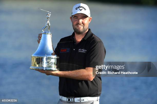 Marc Leishman of Australia celebrates with the winner's trophy on the 18th green after the final round of the Arnold Palmer Invitational Presented By...