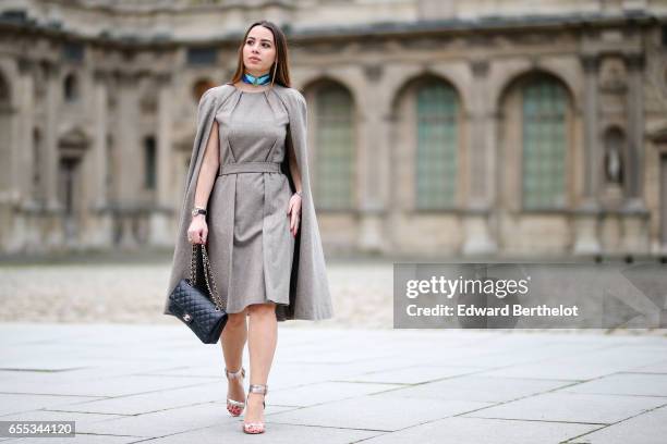 Maria Rosaria Rizzo, fashion blogger La Coquette Italienne, wears a Nobi Talai dress cape, Aperlai Paris heels shoes, an Ines de Parcevaux choker, a...