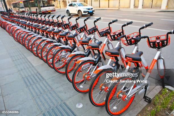 bicycle-sharing in china - sharing economy stock pictures, royalty-free photos & images