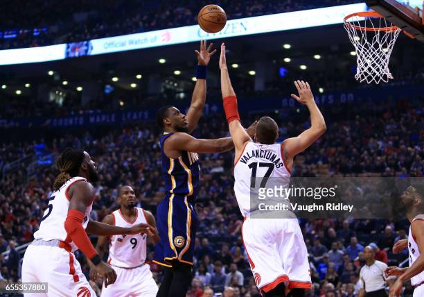 Thaddeus Young of the Indiana Pacers shoots the ball as Jonas Valanciunas of the Toronto Raptors defends during the first half of an NBA game at Air...