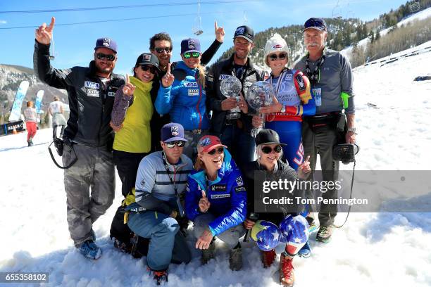 Mikaela Shiffrin poses with friends and family pose with the globes for being awarded the overall season ladies' champion and lasies' season slalom...