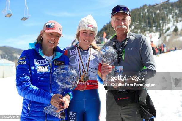 Eileen Shiffrin, Mikaela Shiffrin and Jeff Shiffrin pose with the globes for being awarded the overall season ladies' champion and lasies' season...