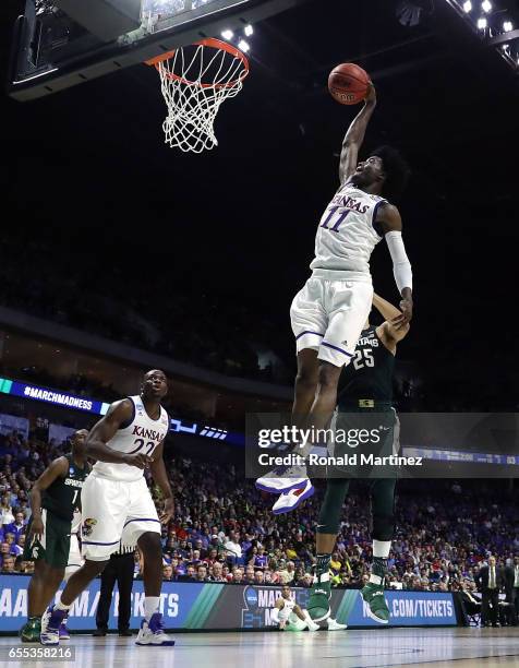 Josh Jackson of the Kansas Jayhawks dunks the ball against the Michigan State Spartans during the second round of the 2017 NCAA Men's Basketball...