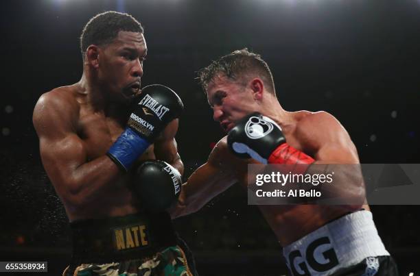 Gennady Golovkin punches Daniel Jacobs during their Championship fight for Golovkin's WBA/WBC/IBF middleweight title at Madison Square Garden on...