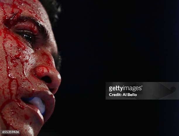 Roman "Chocolatito" Gonzalez is cut against Srisaket Sor Rungvisai during their Championship fight for Gonzalez's WBC junior bantamweight title at...