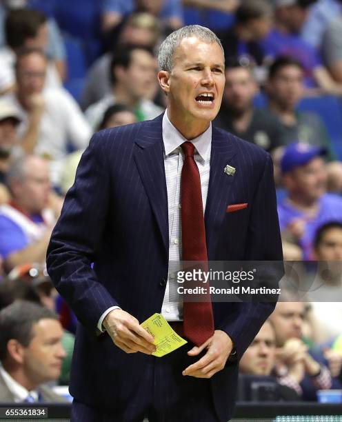 Head coach Andy Enfield of the USC Trojans looks on against the Baylor Bears during the second round of the 2017 NCAA Men's Basketball Tournament at...