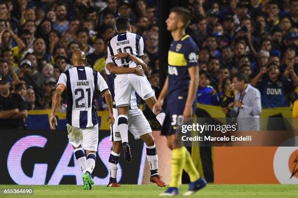 Victorio Ramis of Talleres celebrates with teammates after scoring the first goal of his team during a match between Boca Juniors and Talleres as...