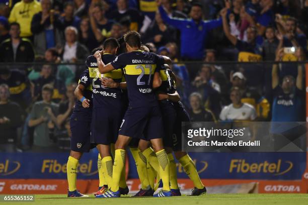 Oscar Benitez of Boca Juniors celebrates with teammates after scoring the first goal of his team during a match between Boca Juniors and Talleres as...