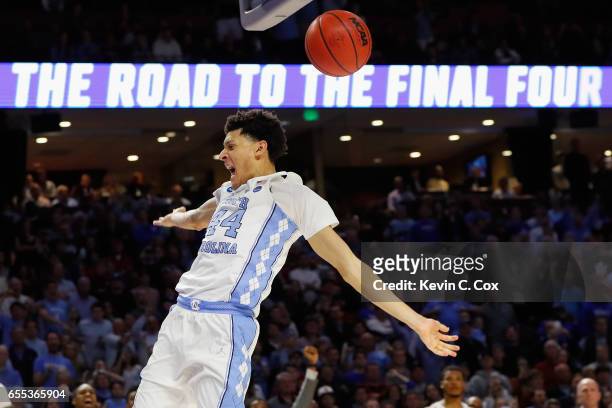 Justin Jackson of the North Carolina Tar Heels dunks the ball at the end of the second half against the Arkansas Razorbacks during the second round...