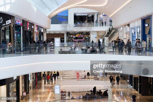 Customers walk through the Starfield Hanam shopping complex, operated by Shinsegae Co., in Hanam, Gyeonggi, South Korea, on Wednesday, March 15,...