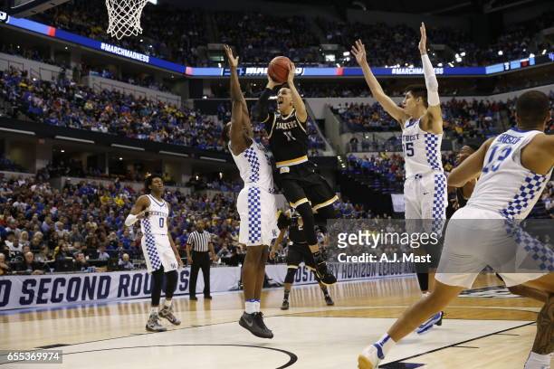 Landry Shamet of Wichita State shoots while playing the University of Kentucky during the 2017 NCAA Photos via Getty Images Men's Basketball...