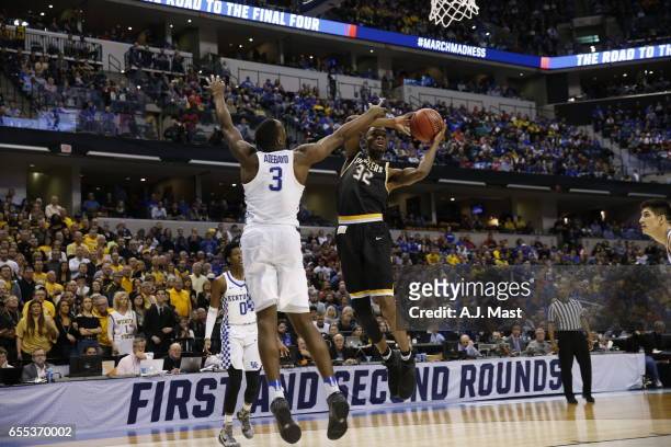 Markis McDuffie of Wichita State shoots over Edrice Adebayo of Kentucky during the 2017 NCAA Photos via Getty Images Men's Basketball Tournament held...