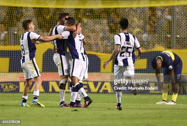 Emanuel Reynoso of Talleres celebrates with teammates after scoring the second goal of his team during a match between Boca Juniors and Talleres as...