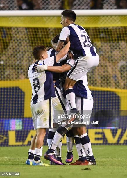 Emanuel Reynoso of Talleres celebrates with teammates after scoring the second goal of his team during a match between Boca Juniors and Talleres as...