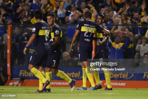 Oscar Benitez of Boca Juniors celebrates with teammates after scoring the first goal of his team during a match between Boca Juniors and Talleres as...