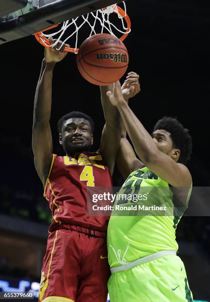 Chimezie Metu of the USC Trojans dunks the ball pas Terry Maston of the Baylor Bears during the second round of the 2017 NCAA Men's Basketball...