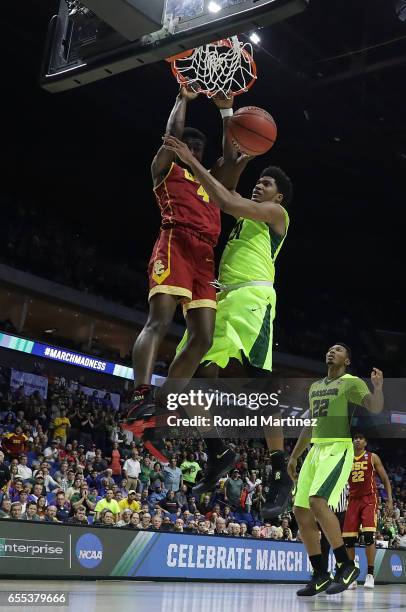 Chimezie Metu of the USC Trojans dunks the ball pas Terry Maston of the Baylor Bears during the second round of the 2017 NCAA Men's Basketball...