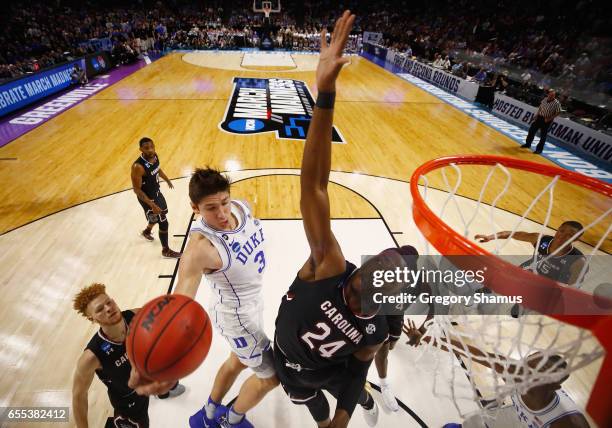 Sedee Keita of the South Carolina Gamecocks defends a shot by Grayson Allen of the Duke Blue Devils in the first half during the second round of the...