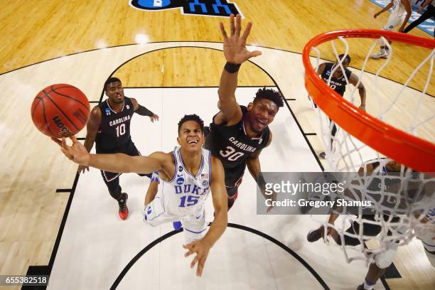 Frank Jackson of the Duke Blue Devils drives to the basket against Chris Silva of the South Carolina Gamecocks in the first half during the second...