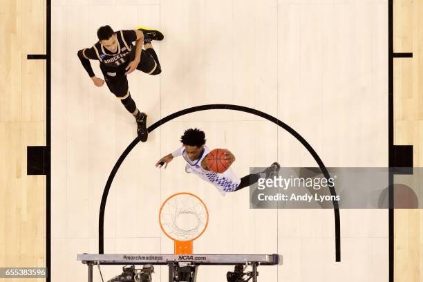 De'Aaron Fox of the Kentucky Wildcats shoots the ball against the Wichita State Shockers during the second round of the NCAA Basketball Tournament at...
