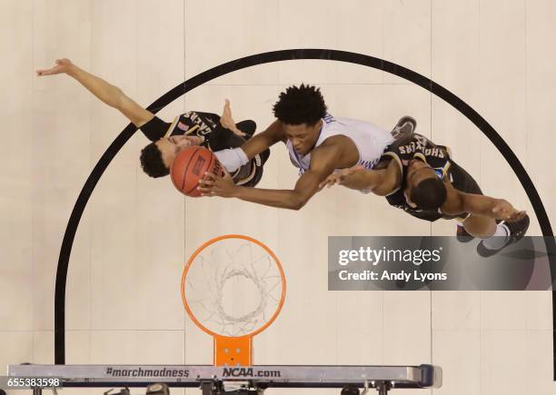 De'Aaron Fox of the Kentucky Wildcats shoots the ball against the Wichita State Shockers during the second round of the NCAA Basketball Tournament at...