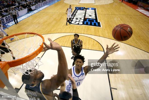 De'Aaron Fox of the Kentucky Wildcats shoots the ball against the Wichita State Shockers during the second round of the NCAA Basketball Tournament at...