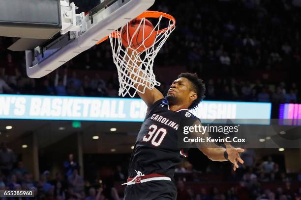 Chris Silva of the South Carolina Gamecocks dunks the ball in the second half against the Duke Blue Devils during the second round of the 2017 NCAA...