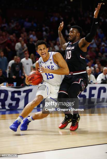 Frank Jackson of the Duke Blue Devils drives against Duane Notice of the South Carolina Gamecocks in the second half during the second round of the...