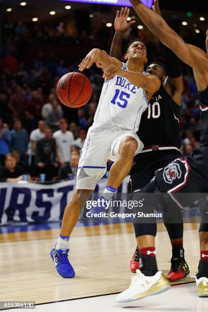 Frank Jackson of the Duke Blue Devils drives against Duane Notice and PJ Dozier of the South Carolina Gamecocks in the second half during the second...