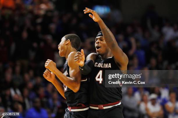 Dozier and Rakym Felder of the South Carolina Gamecocks react in the second half against the Duke Blue Devils during the second round of the 2017...