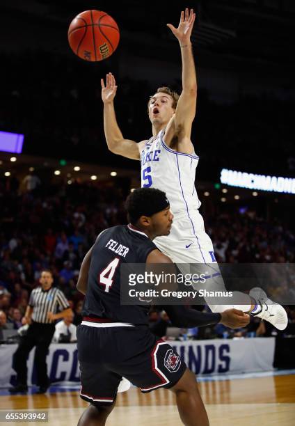Luke Kennard of the Duke Blue Devils loses the ball against Rakym Felder of the South Carolina Gamecocks in the second half during the second round...