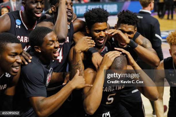 The South Carolina Gamecocks celebrate defeating the Duke Blue Devils 88-81 in the second round of the 2017 NCAA Men's Basketball Tournament at Bon...