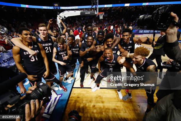 The South Carolina Gamecocks celebrate defeating the Duke Blue Devils 88-81 in the second round of the 2017 NCAA Men's Basketball Tournament at Bon...