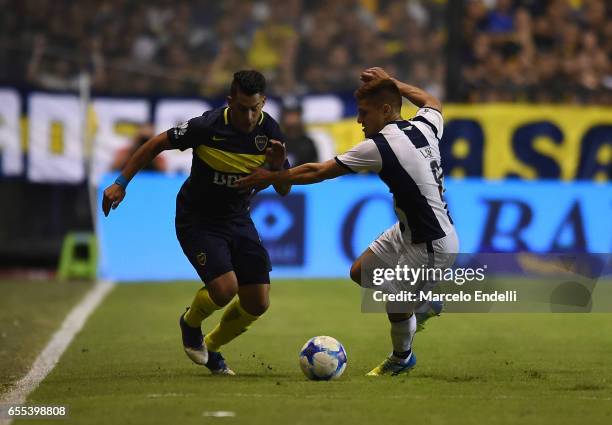 Cristian Pavon of Boca Juniors fights for ball with Leonardo Gil of Talleres during a match between Boca Juniors and Talleres as part of Torneo...