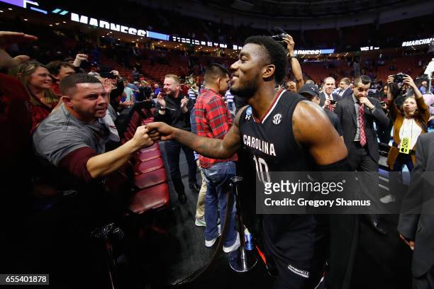 Duane Notice of the South Carolina Gamecocks greets fans after defeating the Duke Blue Devils 88-81 in the second round of the 2017 NCAA Men's...