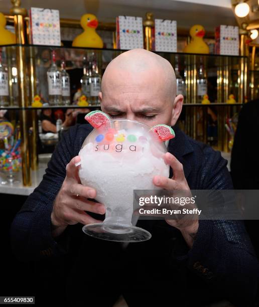 Rapper Pitbull samples a "Watermelon Mojito" at Sugar Factory American Brasserie at the Fashion Show mall as he announces the launch of his Voli 305...