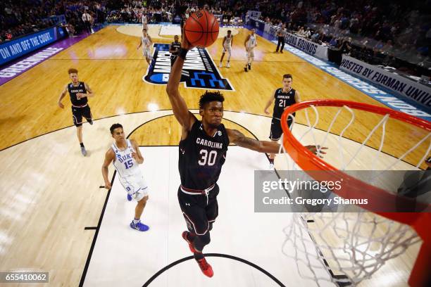 Chris Silva of the South Carolina Gamecocks dunks the ball in the second half against the Duke Blue Devils during the second round of the 2017 NCAA...