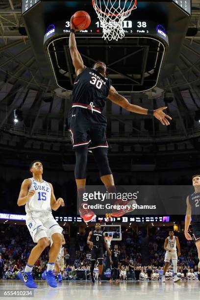 Chris Silva of the South Carolina Gamecocks dunks the ball in the second half against the Duke Blue Devils during the second round of the 2017 NCAA...