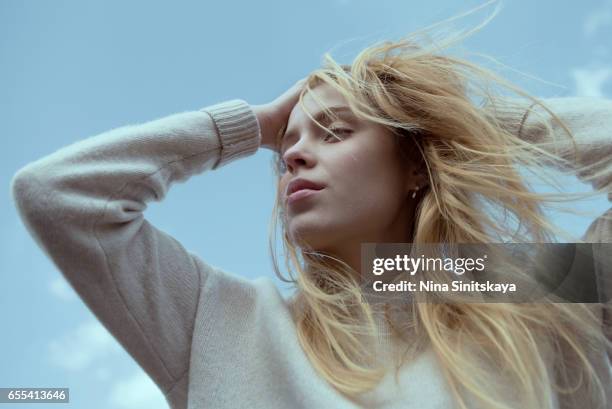 blonde girl breathing fresh air, outdoors - bleached hair woman stock pictures, royalty-free photos & images