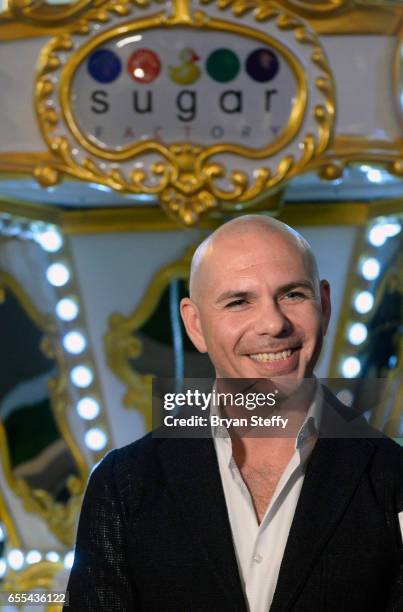 Rapper Pitbull speaks to the press at Sugar Factory American Brasserie at the Fashion Show mall announcing the launch of his Voli 305 vodka brand's...