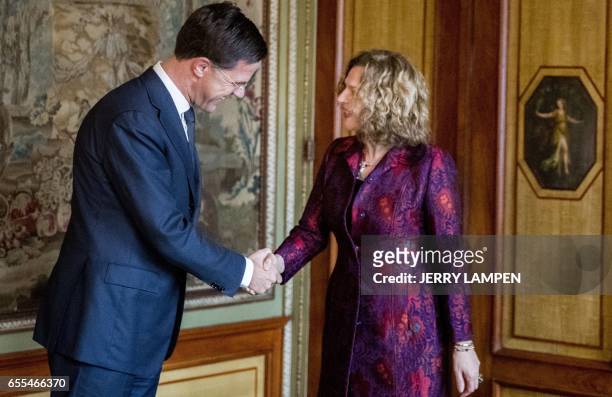 Dutch Health minister Edith Schippers welcomes newly re-elected Dutch Prime Minister Mark Rutte, leader of the right-wing Liberal VVD, in her role of...