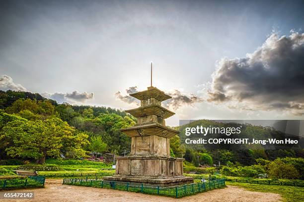 sunshine from behind the big stone pagoda - gyeongju stock pictures, royalty-free photos & images