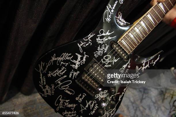 Guitar featuring the signatures cast members of the television series 'Degrassi Junior High' and 'Degrassi', including Aubrey Drake Graham at Toronto...