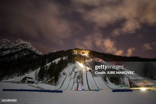 Picture taken on February 18, 2017 shows a night view of the ski jumping and ski flying hills in Planica, Slovenia. Slovenia may be small, but this...