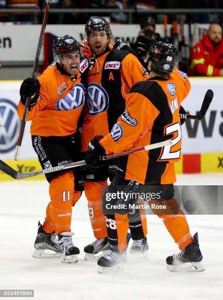 Brent Aubin of Wolfsburg celebrate with his team mates after scoring a goal during the DEL Playoffs quarter finals Game 4 between Grizzlya Wolfsburg...