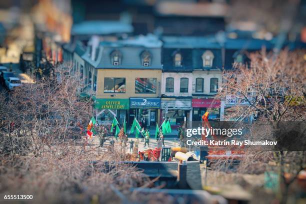 st. patrick's day parade in miniature town. tilt-shift - saint patricks day parade stock pictures, royalty-free photos & images