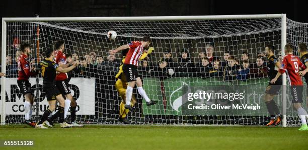 Donegal , Ireland - 13 March 2017; Ryan McBride of Derry City scores his side's third goal despite the challenge of Gabriel Sava of Dundalk during...