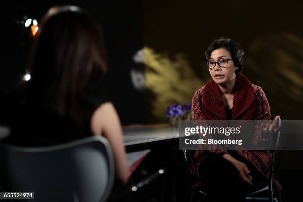 Sri Mulyani Indrawati, Indonesia's finance minister, right, gestures as she speaks during a Bloomberg Television interview in London, U.K., on...