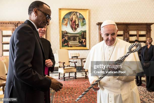 Pope Francis exchanges gifts with President of of Ruanda Paul Kagame during an audience at the Apostrolic Palace on March 20, 2017 in Vatican City,...