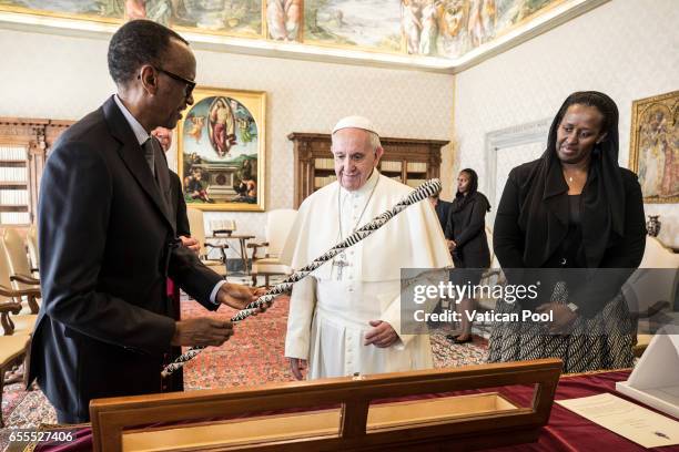 Pope Francis exchanges gifts with President of of Ruanda Paul Kagame and his wife Jeannette Nyiramongi during an audience at the Apostrolic Palace on...